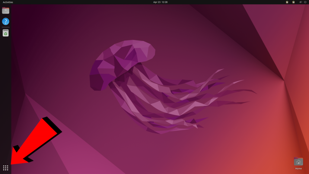 A red arrow pointing to the bottom left side of the ubuntu main screen.