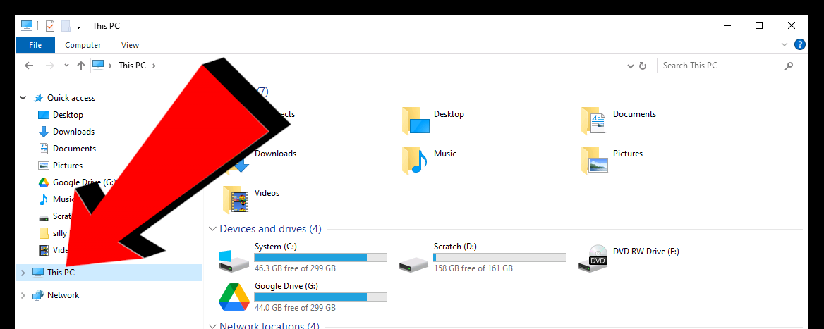 A screenshot of the Windows file explorer, with a big red arrow pointing towards the "This PC" dropdown closed.